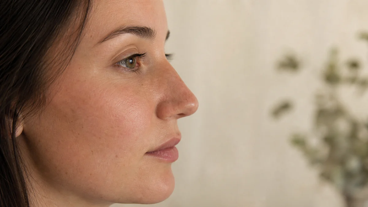Natural side-profile editorial view focused on the nose for rhinoplasty planning